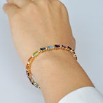 A styled view of the colorful line bracelet worn by model.