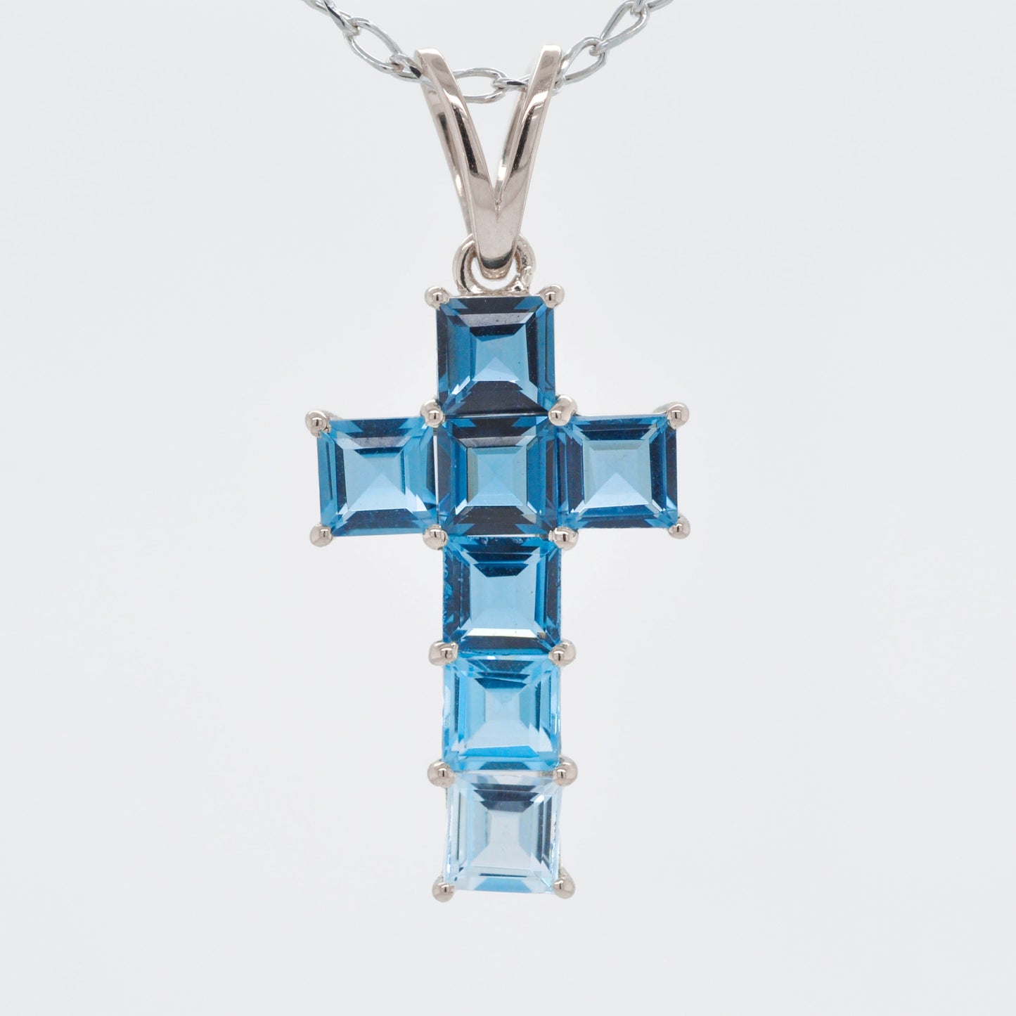 Linear Blue Topaz Cross Pendant