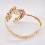 Rear view of the multi-gemstone spiral bracelet, displaying the clean, comfortable 14K yellow gold frame construction and smooth finish.