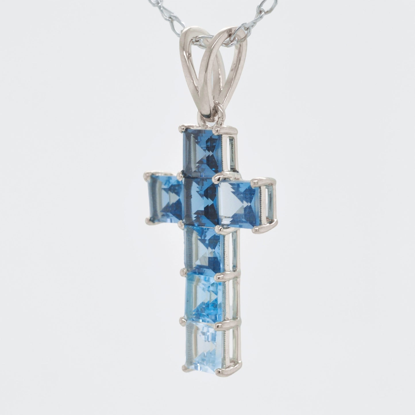 Linear Blue Topaz Cross Pendant
