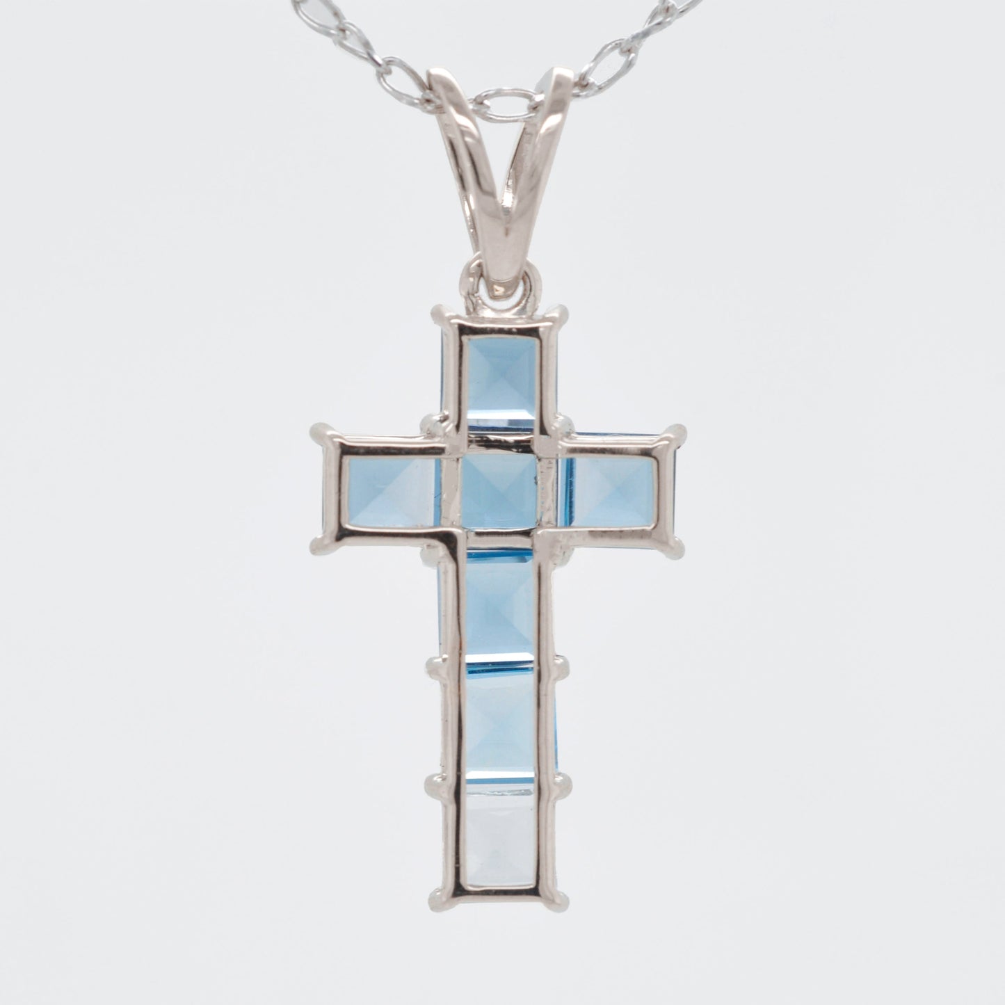Linear Blue Topaz Cross Pendant