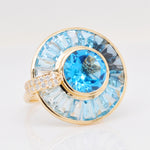 High end blue topaz spinner ring with diamond accent detail