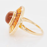 Close-up of the gemstone clarity and the high-polish finish of the 14K yellow gold mounting.