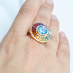 Elegant woman wearing multi gemstone spinner ring statement jewelry