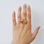 On-hand view of the 14K gold citrine ring showing its scale and appearance when worn as a cocktail piece.