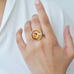 Hand wearing citrine cabochon ring showing the cabochon stone and gradient citrine.