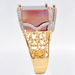 Profile view of the 14K gold ring, highlighting the secure prong setting of the large ametrine.