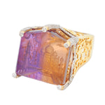 Macro shot of the intricate hand-carved Taj Mahal details inside the faceted ametrine gem.
