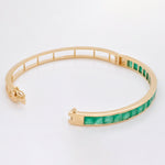 Detailed perspective of the internal hinge and the smooth, snag-free surface of the polished gold bracelet back.