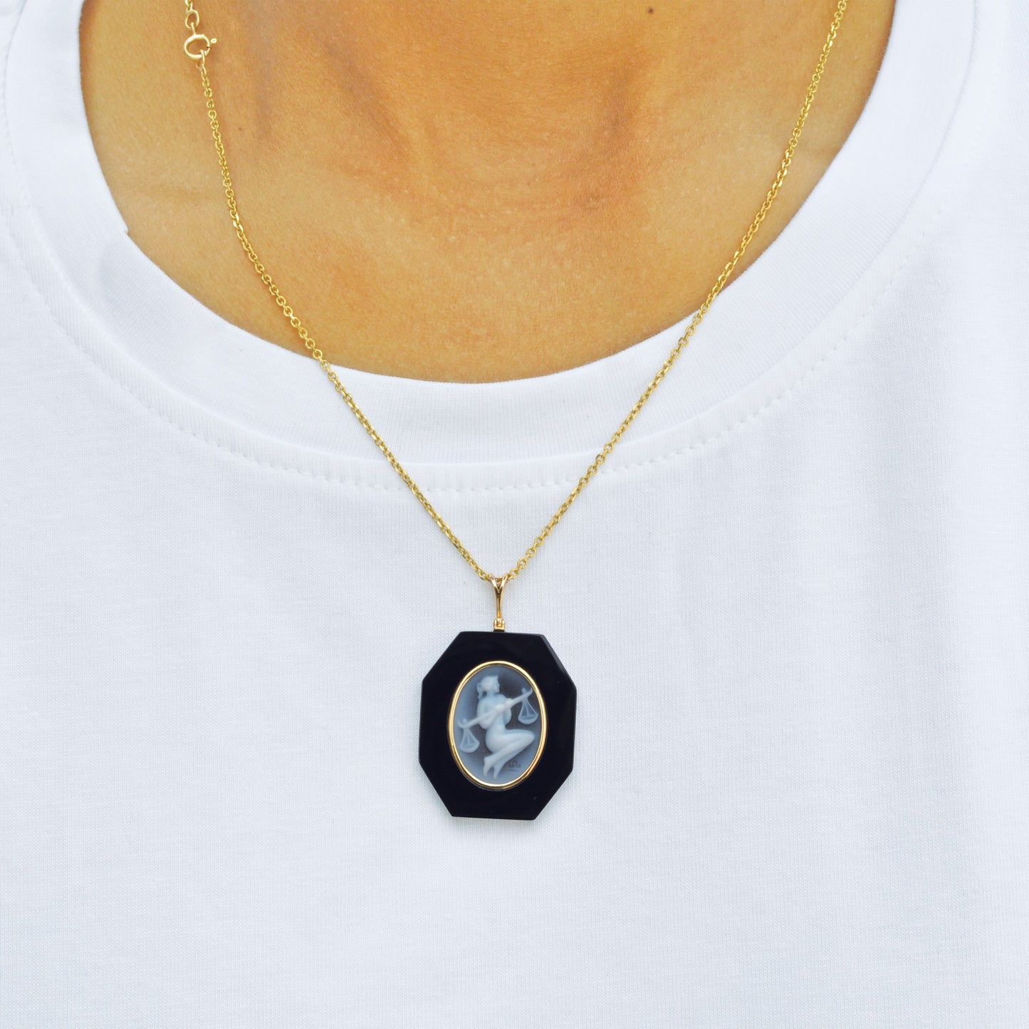 Sleek Black Onyx Pendant Showcasing Libra Zodiac Symbol.