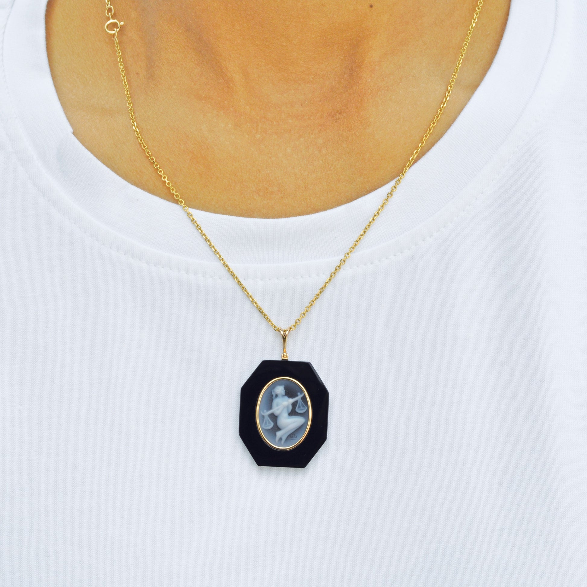 Sleek Black Onyx Pendant Showcasing Libra Zodiac Symbol.
