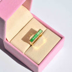 green gemstone ring yellow gold