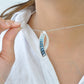 Sickle Blue Topaz Pendant
