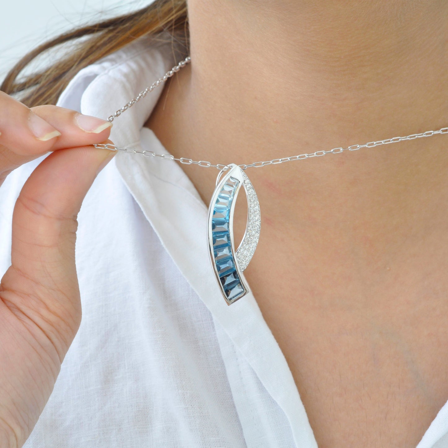 Sickle Blue Topaz Pendant