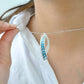 Sickle Blue Topaz Pendant