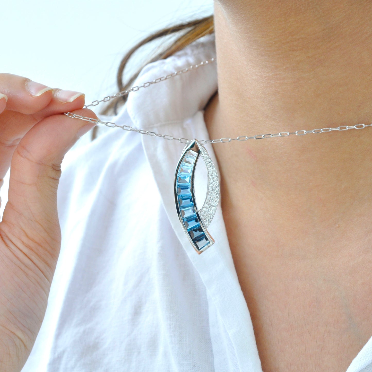 Sickle Blue Topaz Pendant