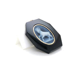 Close‑up of Aries Zodiac Pendant with Bold Ram Horns Engraved on Onyx Stone. 