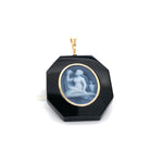 Black onyx Virgo pendant with gold bezel.