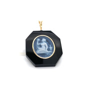Black onyx Virgo pendant with gold bezel.