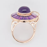 A styled flat lay of the gold amethyst ring.