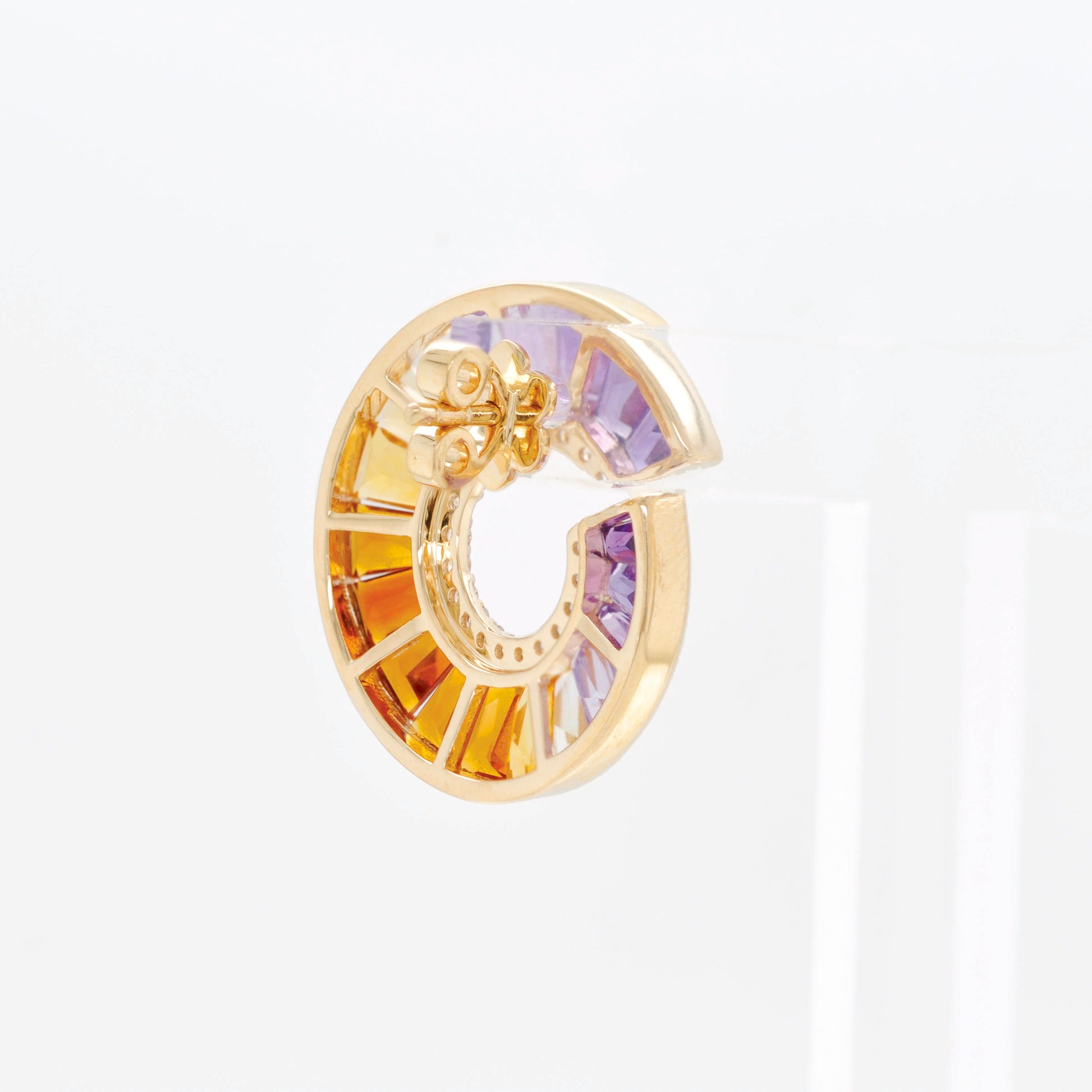 Luxurious ametrine earrings with a sculptural curved silhouette and radiant gemstone gradient enhanced by diamonds