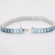 Close-up of the integrated box clasp and double-safety latch on the blue topaz bracelet.