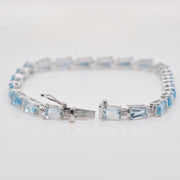 Close view showing how to operate the integrated closure on the blue topaz and diamond jewelry piece.