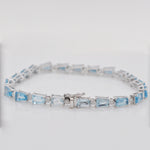 Detailed perspective of the reverse side of the box clasp and safety latch for the blue gemstone bracelet.