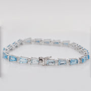 Detailed perspective of the reverse side of the box clasp and safety latch for the blue gemstone bracelet.