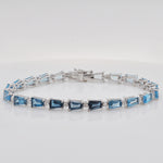 A close look at the fine craftsmanship and smooth finish of the polished white gold links on the gemstone bracelet.