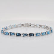 A close look at the fine craftsmanship and smooth finish of the polished white gold links on the gemstone bracelet.