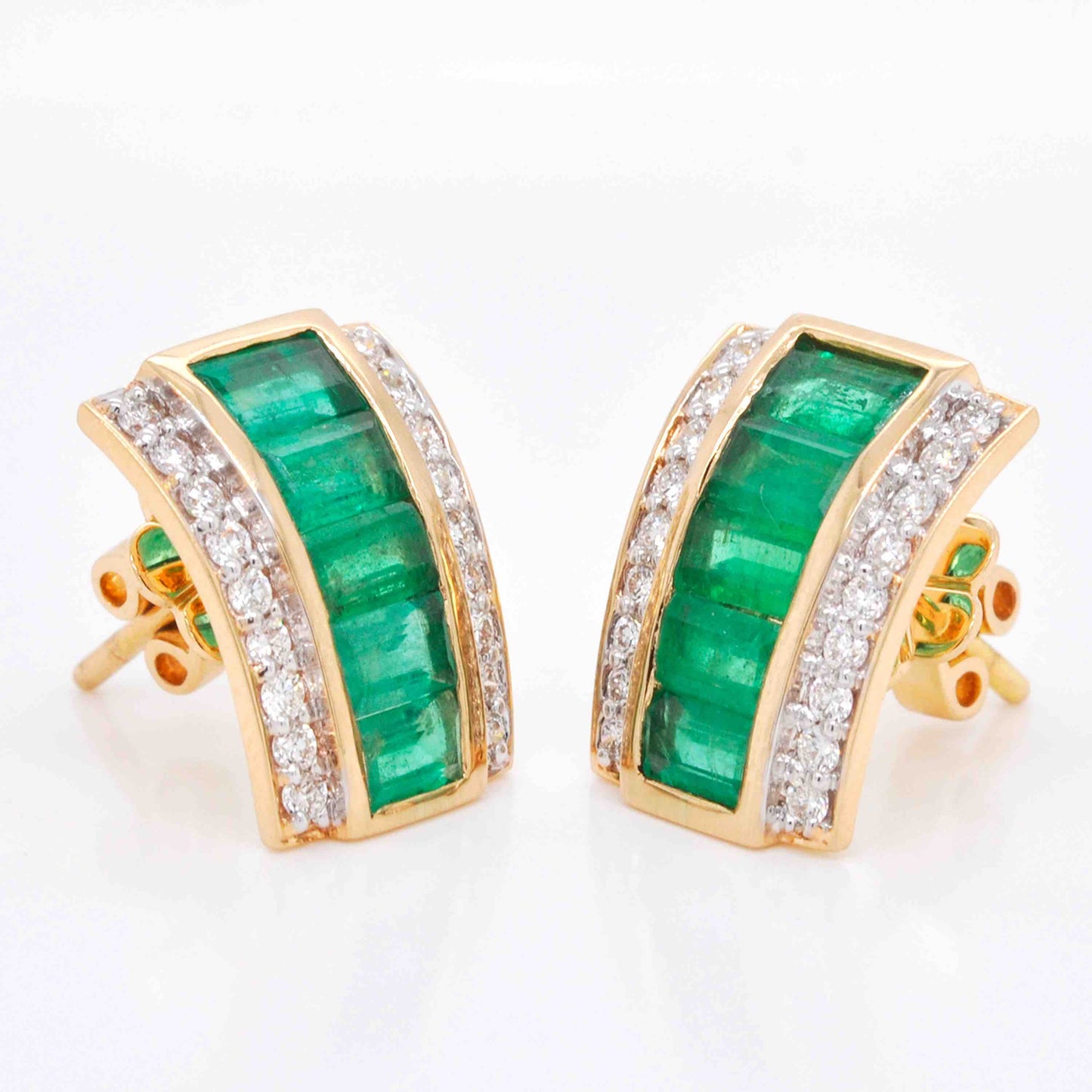 Stud earrings with emeralds