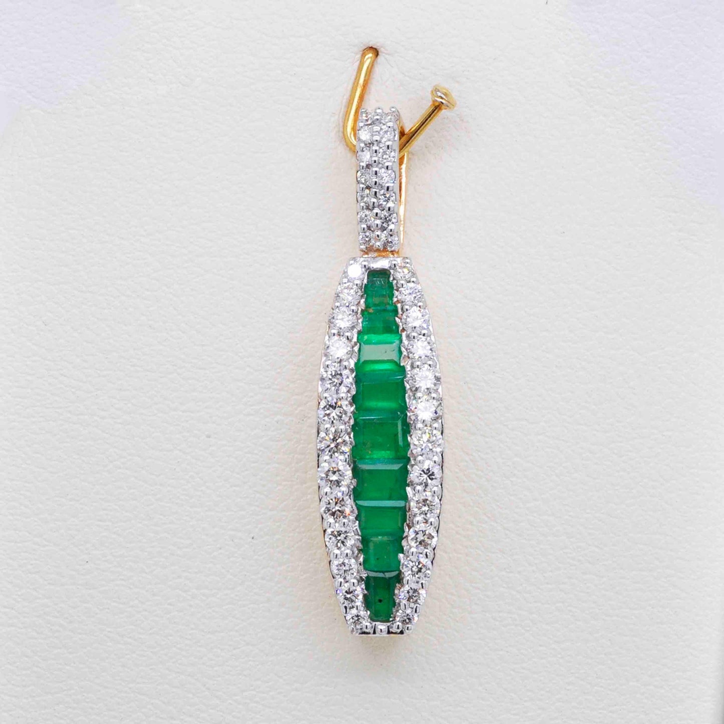 emerald and diamond pendant yellow gold