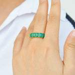 Model's hand displaying the 14K Gold emerald eternity band.