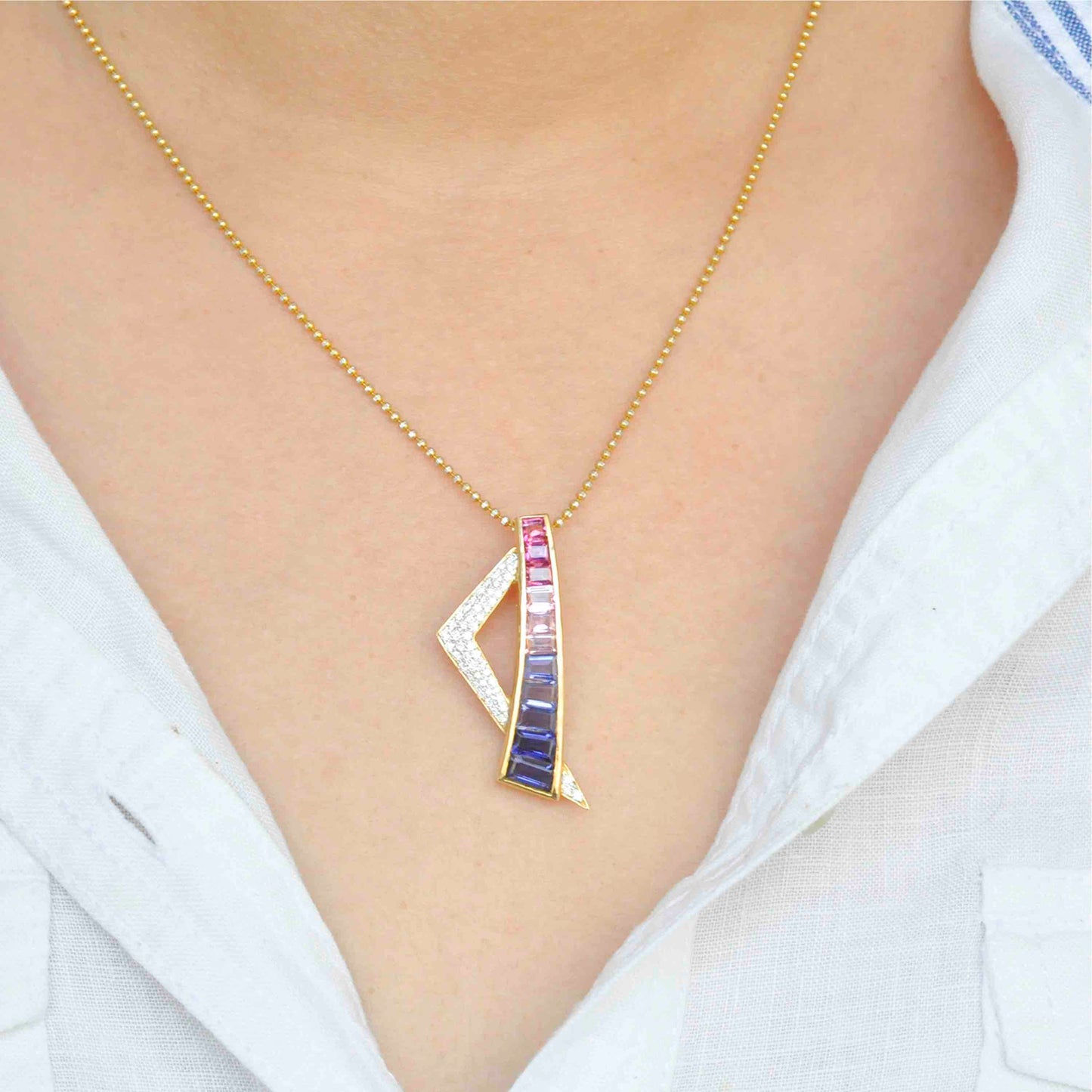 contemporary pendant showcasing pink tourmaline, iolite, and diamonds