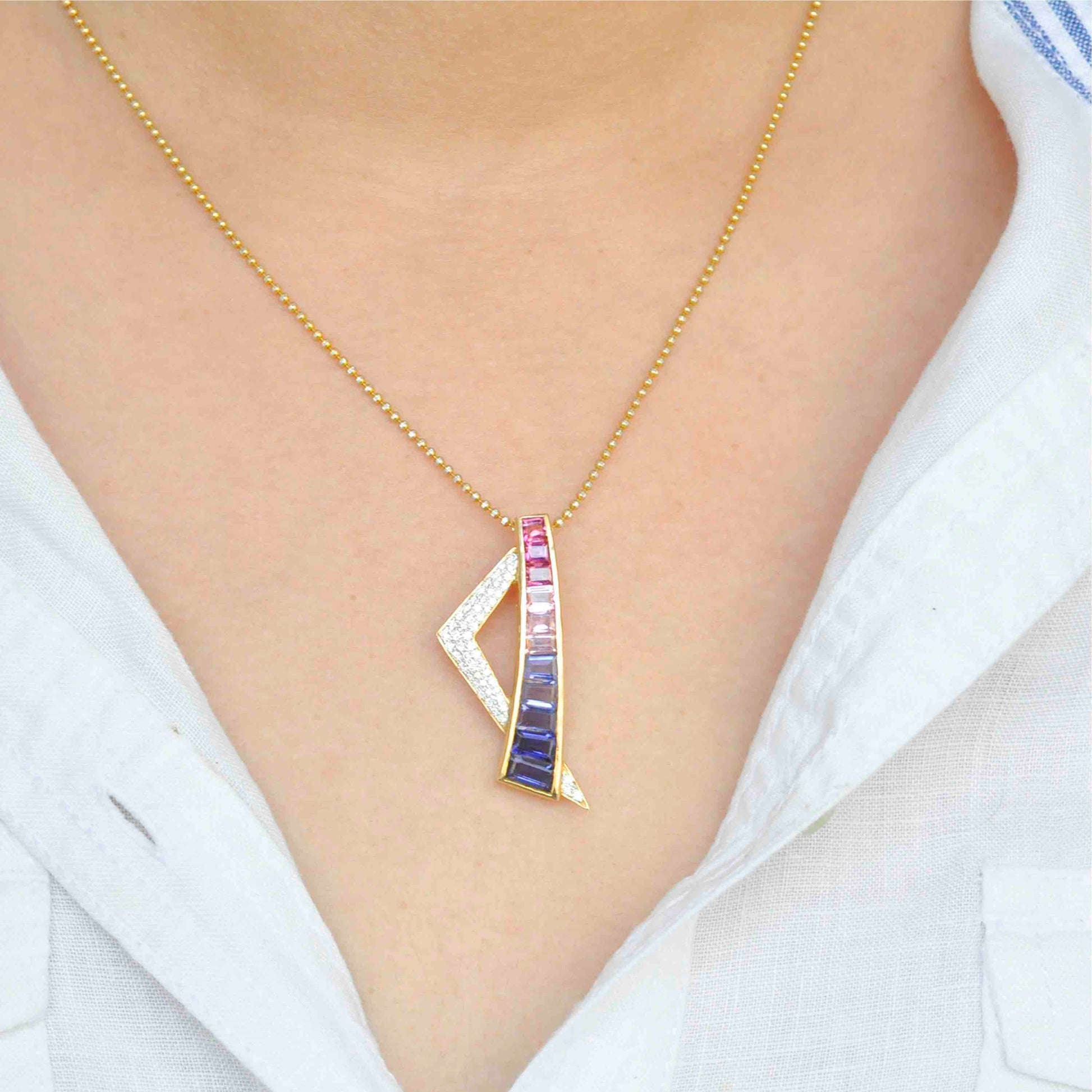 contemporary pendant showcasing pink tourmaline, iolite, and diamonds