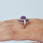 Detailed close view of the Pave diamond-set bar and the radiating amethyst.