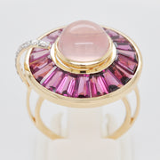 Detailed view of the gemstone setting craftsmanship, showing the smooth gold bezel and baguettes.
