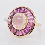 Macro shot of the central bezel-set rose quartz cabochon.