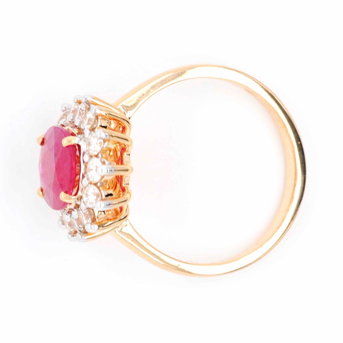 Ruby Diamond Cluster Ring with an alluring oval shape and lustrous gemstones