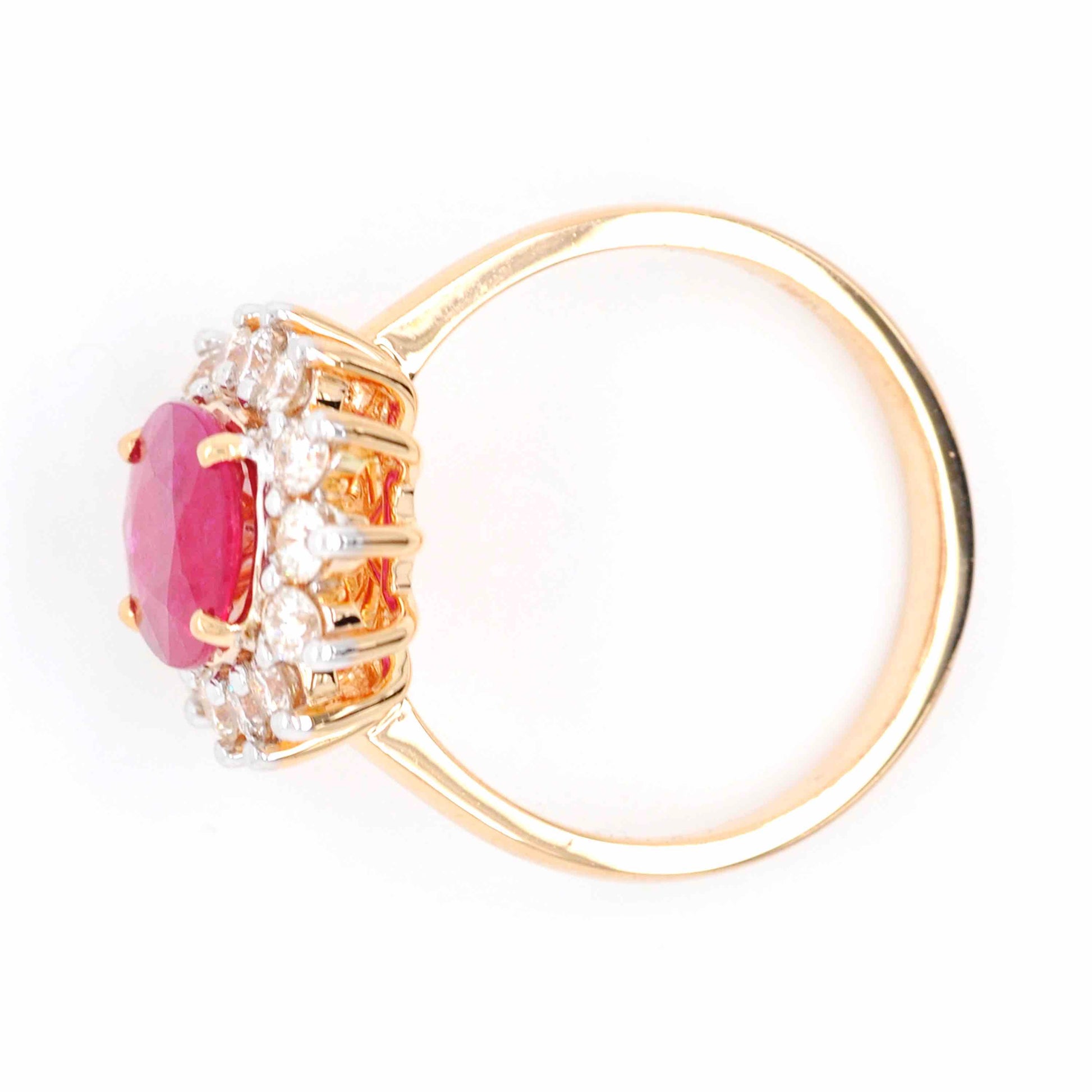 Ruby Diamond Cluster Ring with an alluring oval shape and lustrous gemstones