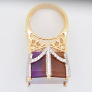Clear view of the solid gold shank and the structural support holding the large carved ametrine.