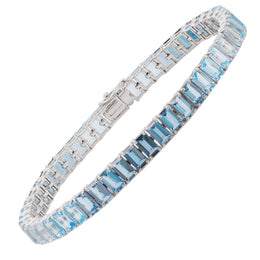 Octagon-cut blue topaz tennis bracelet in 14k white gold on a clean white background.