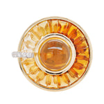 14K gold rotating ring with a central cabochon citrine and radiating channel-set tapered baguettes.