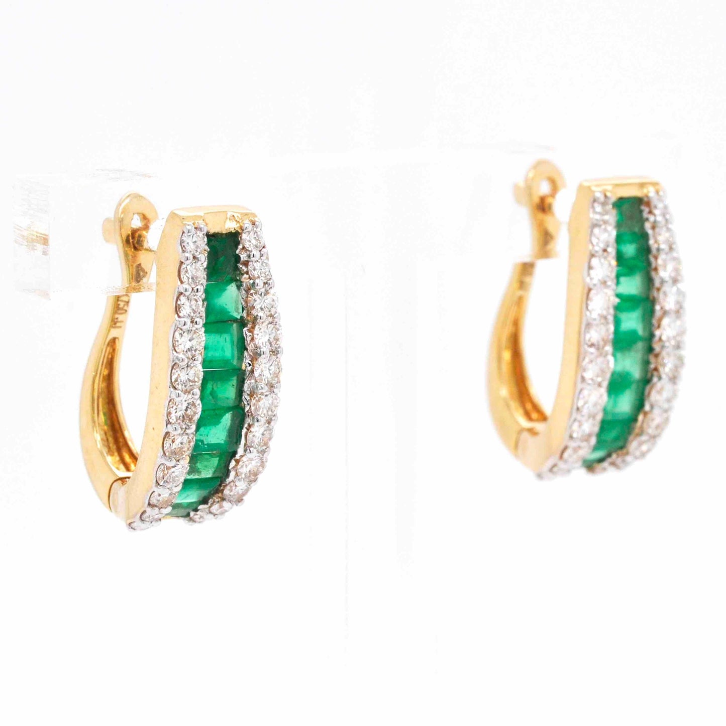 Huggie hoop earrings with emerald gemstones