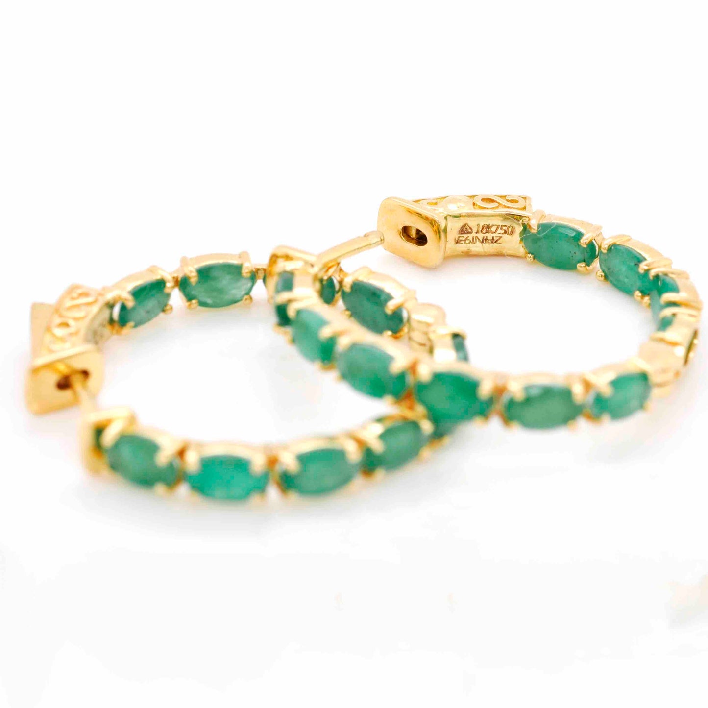 Handcrafted gold hoops with genuine emerald gemstones