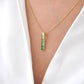 Pendentif barre baguette en tsavorite en or 18 carats