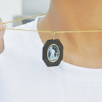 Aquarius Pendant with Black Onyx and Gold around Edge.
