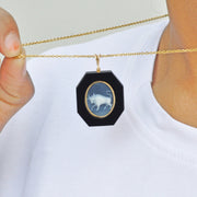 Intricate Taurus Design Carved Into Natural Onyx Pendant.